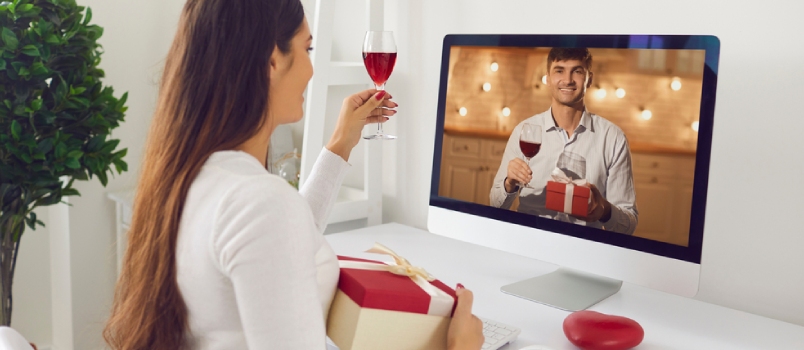 Happy Woman Looking at Man on Computer Screen and Giving Toast on Romantic Virtual Date