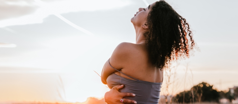 Young Lady Enjoying Nature Outside With Sunset View