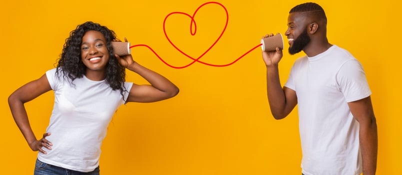 American African Couple Communicating Together With Yellow Background