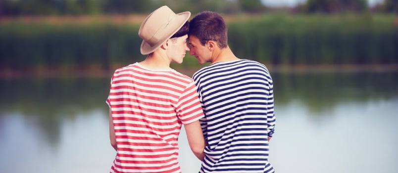 Gay Couple in Love on River Bank