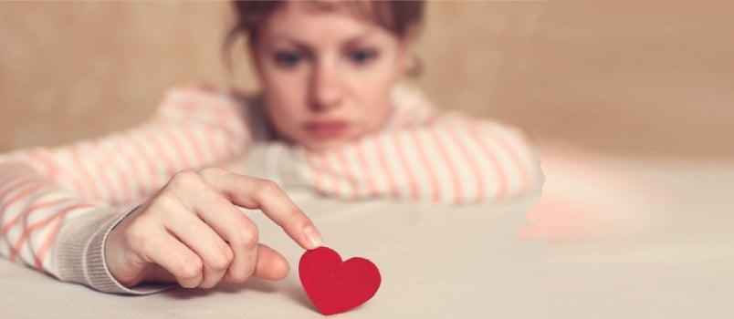 Woman Is Thinking About Unrequited Love and Relations Difficulties. Focus Is on Heart