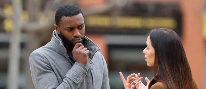 Man paying extra attention to what his wife is saying