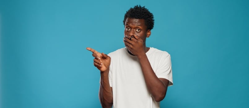 Man covering his mouth with his hands