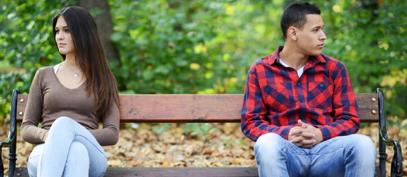 Sad Upset Men and Women Sitting Alone on the Bench at Park