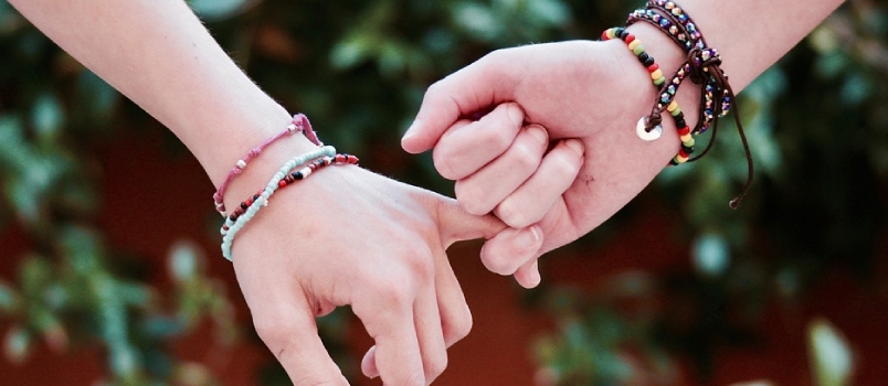 Couple Holding Their Hands Together