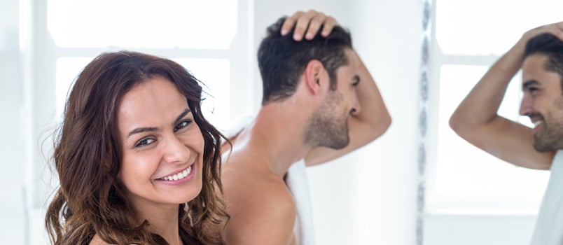 Passionate Men and Women While Men Is Looking Into Mirror Himself