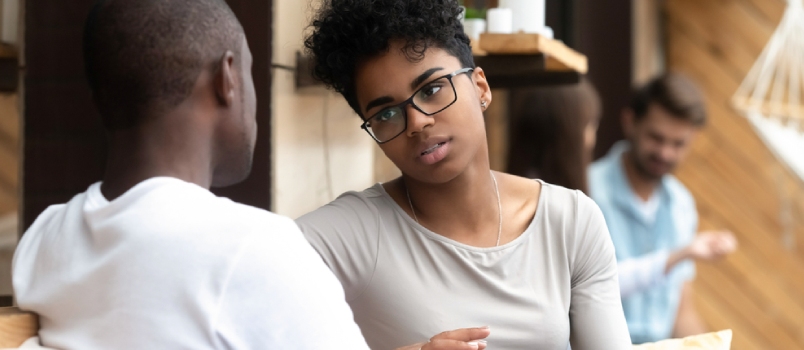 Focused African American Woman Talking With Man in Cafe, Girlfriend Discussing Relationships With Boyfriend