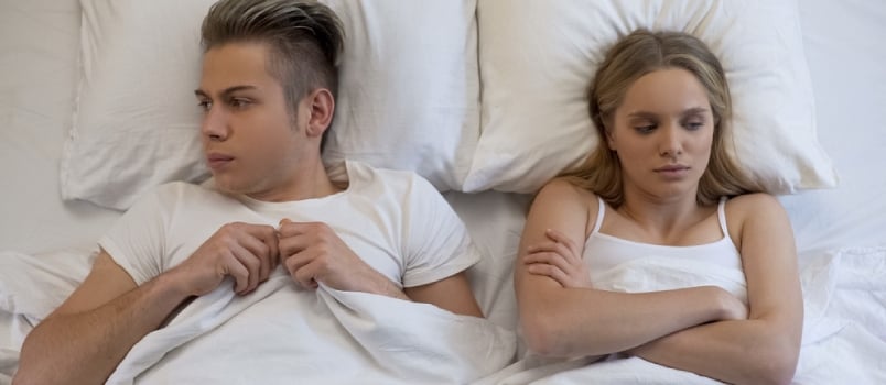 Young Wife Looking Dissatisfied With First Sex Experience, Embarrassed Boyfriend