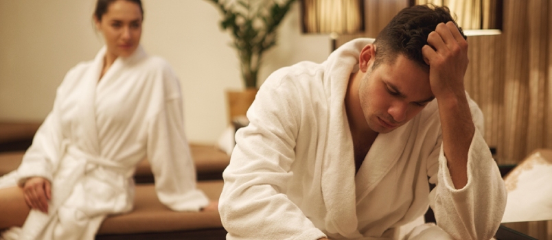 Sad Upset Couple Sitting in the Bedroom