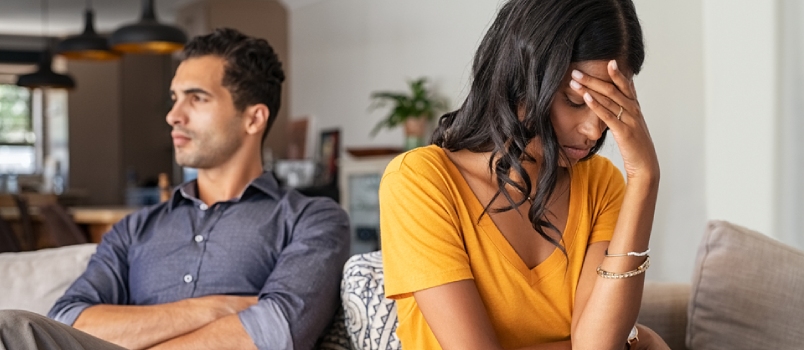 Sad Indian Woman Sitting With Hand on Head After Quarrel With Boyfriend at Home
