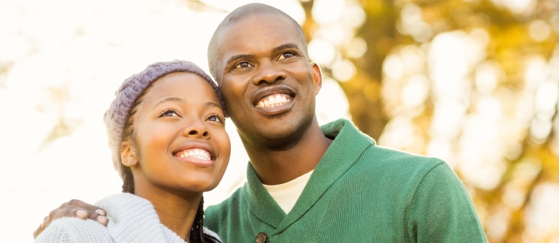 Portrait of a Lovely Smiling Young Couple on an Autumns Day