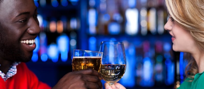 Young Romantic Couple Enjoying Cocktails in Nightclub
