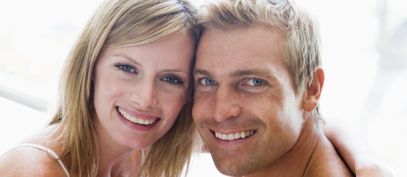 man and women cuddling indoors