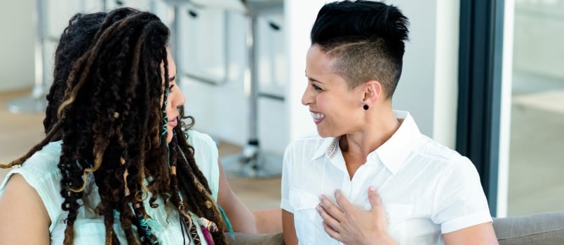 Lesbian Couple Talking to Each Other in Living Room