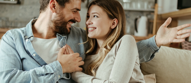 Loving Happy Couple Talking to Each Other at Home