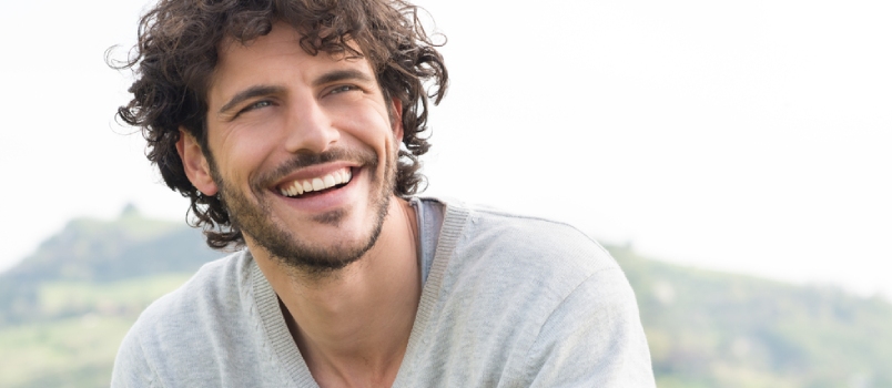 Portrait of Young Handsome Man Smiling Outdoor