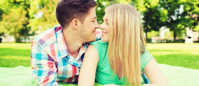 Boyfriend and Girlfriedn in the Park on Holiday Playing Eye Contact Game Together