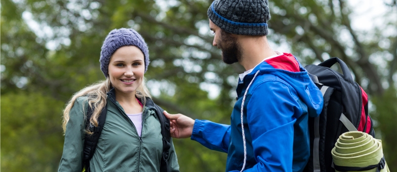 Hiker Couple Pointing at Distance at Countryside