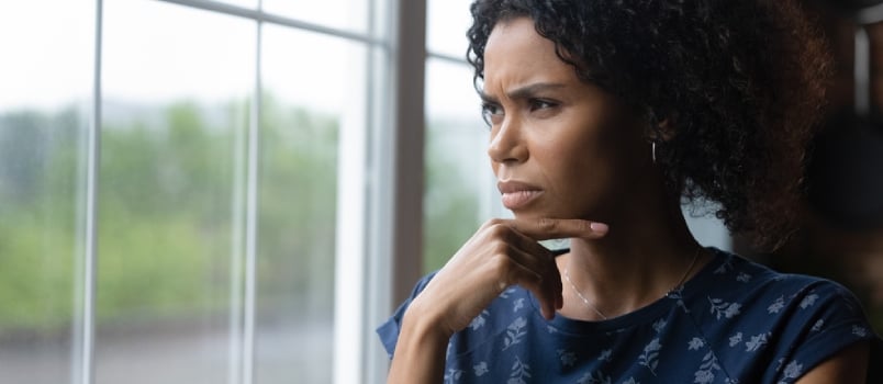 Unhappy Young African Ethnicity Woman Looking Out of Window, Thinking of Life Problems, Copy Space