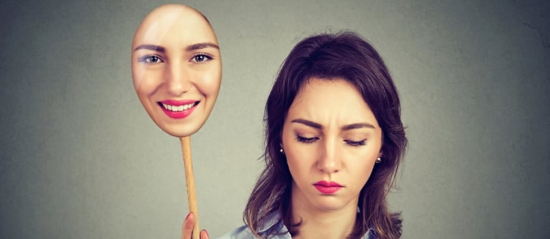 Sad Woman Looking Down Taking Off Happy Mask of Herself