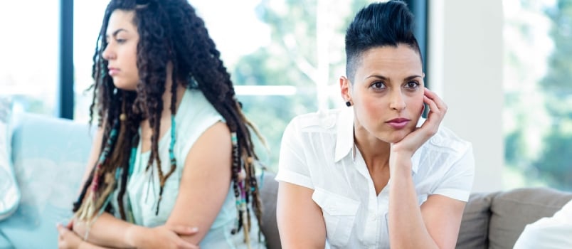 Disappointed Lesbian Together While One Partner Is Not Agreed With Other One Sitting on the Couch at Home