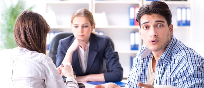 Young Family Filing Divorce Papers With Lawyer