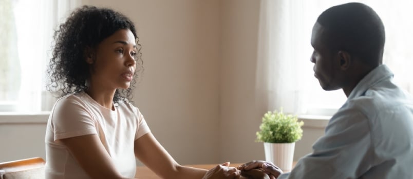 Afro Couple Communicating Together at Public Place or Cafe