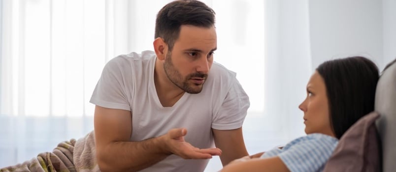 Young Couple Is Arguing in Bed