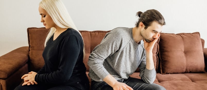 Spouses Sit Separate on Sofa at Home Ignore Each Other Avoid Talking After Arguing