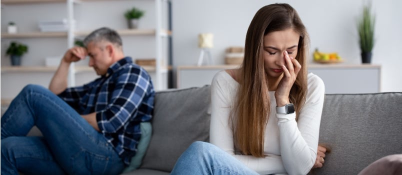 Unhappy woman wiping her tear 