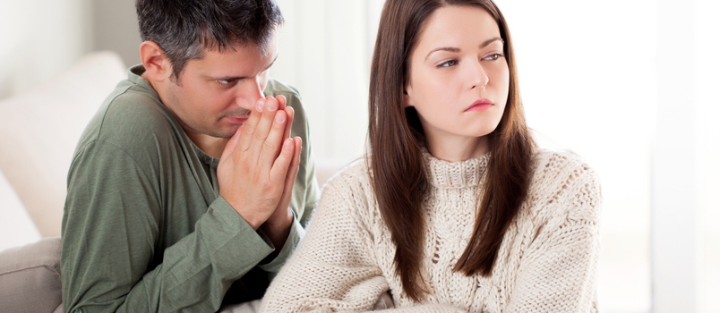 Image of Young Man Begging His Girlfriend to Forgive Him