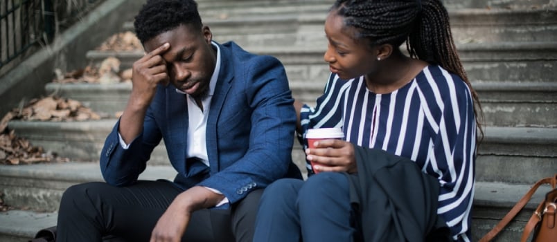 Woman Consoling Her Colleague Outside of College on Stairs