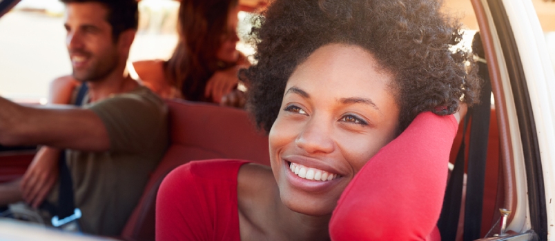 Group of Friends Relaxing in Car During Road Trip
