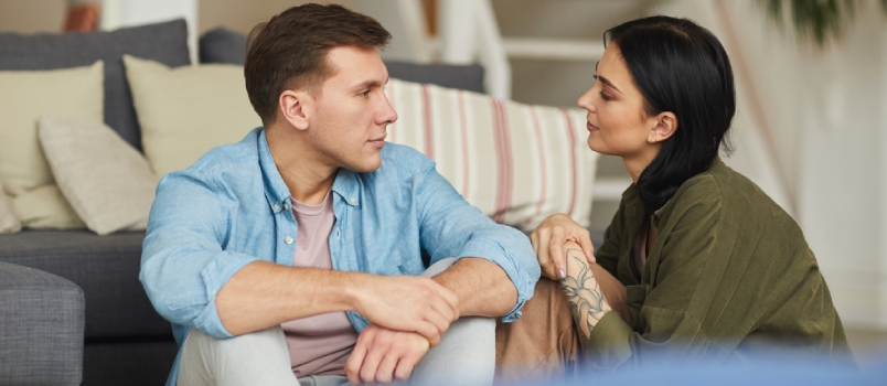 couple talking to each other while having coffee
