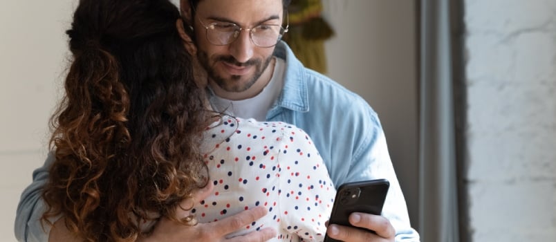 Suspicious Jealous Boyfriend Hug Girlfriend Checking Her Phone Calls Contacts Behind Back