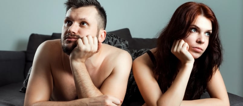 A Couple, a Man and a Woman Are Lying in Bed Without Sexual Desire