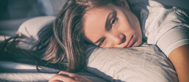 Tired Woman Lying in Bed Can't Sleep Late at Night With Insomnia