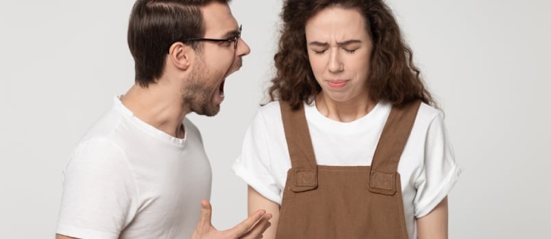 Young Unhappy Couple Isolated on Grey Studio Background, Mad Angry Guy Open Mouth Screaming at Girlfriend