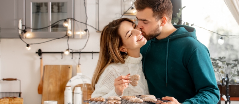 Young Married Couple Baking Cookies in the Kitchen