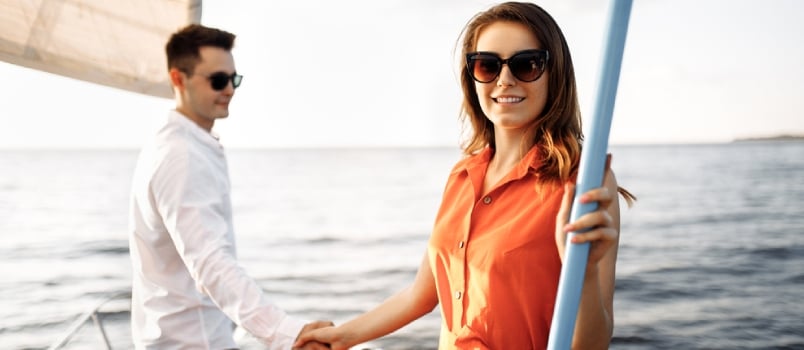 A Couple in Love on the Edge of the Yacht Hug and Hold Hands, Show Love, Strong Hugs