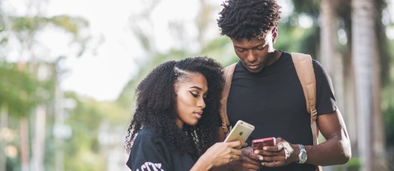 Men's Black Crew Neck Shirt Couple Using Mobile
