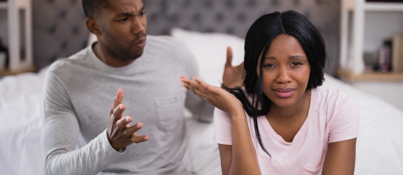 Close Up of Young Couple Arguing While Sitting at Home