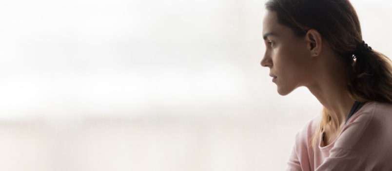 Sad Alone Women Sitting and Looking Outside From the Window