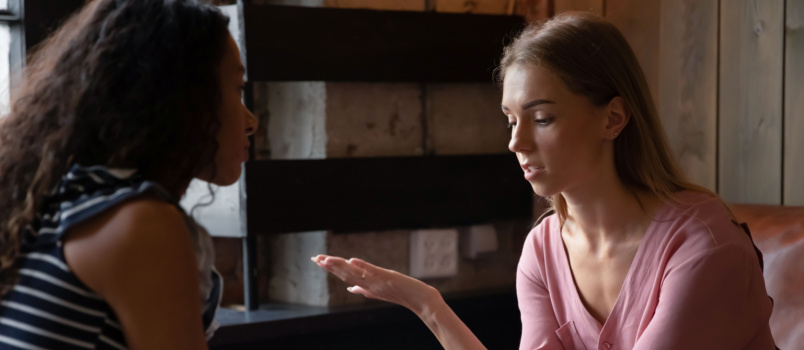 Woman comforting another woman