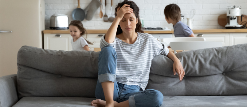 depressed woman sitting on a couch