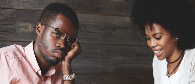 unhappy man with happy woman