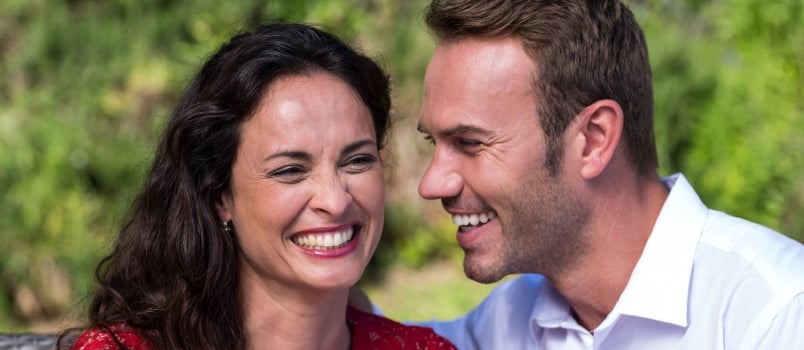 Close-up of smiling happy couple in lawn