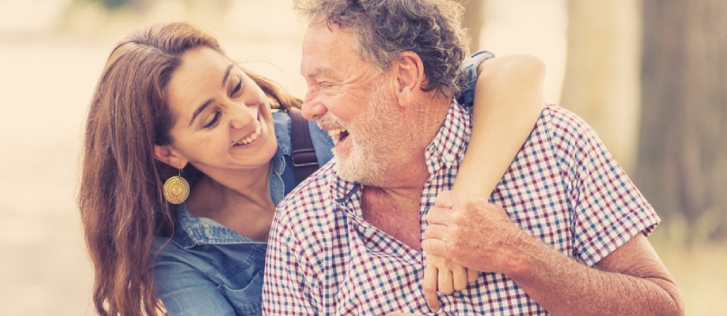 Old Man and Teen Daughter Laughing Together Enjoying the Day