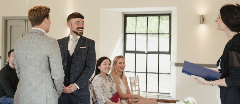 Two Men Are Exchanging Vows on Their Wedding Day.