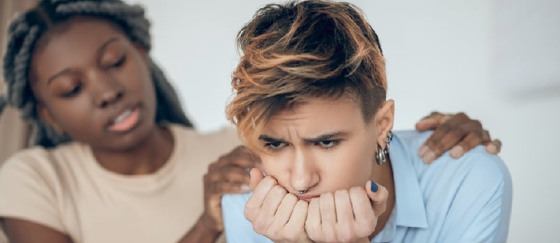 Unhappy. Same sex couple having an argument and looking unhappy